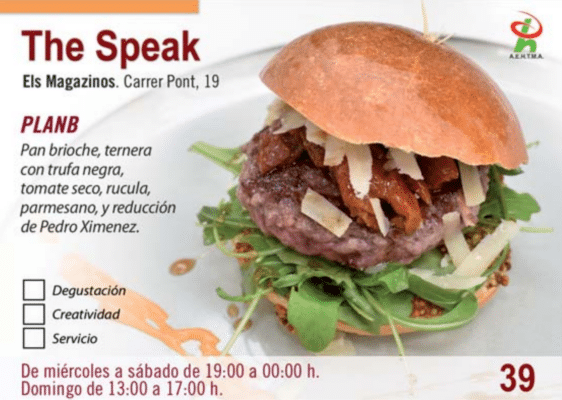 Hamburguesa gourmet con trufa y rúcula en pan brioche.