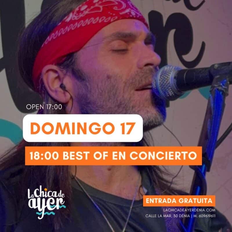 Cantante con pañuelo rojo cantando en concierto